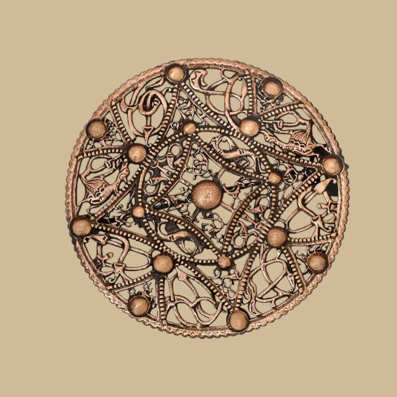 Round bronze brooch in the Nordic Viking style from the 10th century